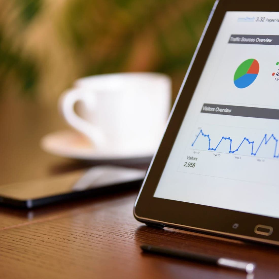 Marketing performance charts and analytics on a desk, illustrating MDF pipeline attribution